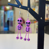 Clay figure earrings "pink skeletons"