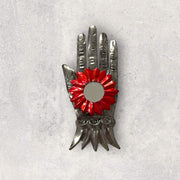 Tin hand with flower